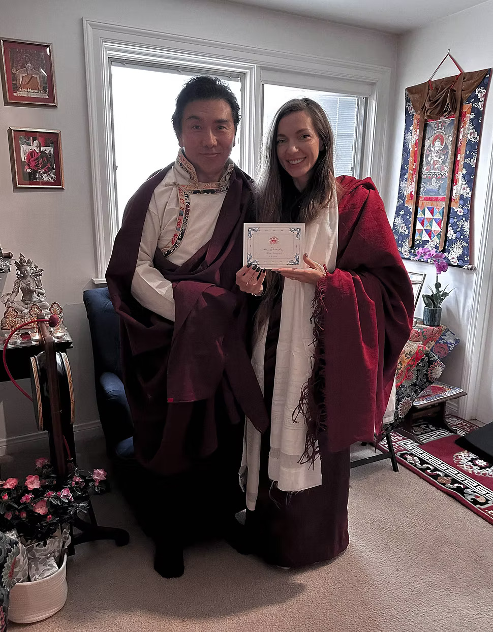 Sasha with her spiritual teacher Pema Namdol Thaye holding a certificate